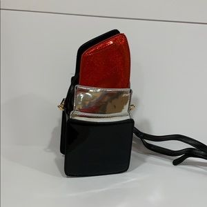 - “Lipstick” purse. Vegan leather